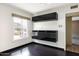 Bedroom with built-in storage cabinets, window and dark hardwood floors at 7542 N 22Nd Pl, Phoenix, AZ 85020