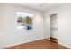 Bright bedroom with sliding closet doors and window overlooking the yard at 7542 N 22Nd Pl, Phoenix, AZ 85020