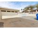 Attached two-car garage with a well-maintained driveway and a partial view of the surrounding neighborhood at 7542 N 22Nd Pl, Phoenix, AZ 85020