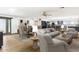 Spacious living room featuring modern decor, a dining area, and an open layout to the kitchen at 7542 N 22Nd Pl, Phoenix, AZ 85020