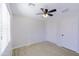 Bright bedroom featuring modern ceiling fan, wood-look floors, and closet at 7769 W Bonitos Dr, Phoenix, AZ 85035