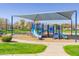 Community playground area with shade and play equipment at 7769 W Bonitos Dr, Phoenix, AZ 85035