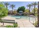 Community pool featuring palm trees and ample space at 7769 W Bonitos Dr, Phoenix, AZ 85035