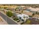 Aerial view of a modern home featuring a pool, lush landscaping, and neighborhood amenities nearby at 8319 E Columbus Ave, Scottsdale, AZ 85251