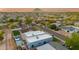 Expansive aerial view of a residential area highlighting a modern home with pool and surrounding cityscape at 8319 E Columbus Ave, Scottsdale, AZ 85251