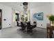 Dining room with modern chandelier, large table, and a view to the outdoors at 8319 E Columbus Ave, Scottsdale, AZ 85251