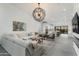 Spacious living room featuring an open layout and an modern chandelier at 8319 E Columbus Ave, Scottsdale, AZ 85251