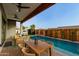 Charming outdoor dining area overlooking the pool, perfect for enjoying meals outdoors at 8319 E Columbus Ave, Scottsdale, AZ 85251