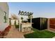 Modern outdoor kitchen with bar seating, ideal for entertaining in a landscaped backyard at 8319 E Columbus Ave, Scottsdale, AZ 85251