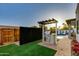 Outdoor kitchen and grill area with pergola, ideal for backyard barbecues and entertaining at 8319 E Columbus Ave, Scottsdale, AZ 85251