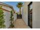 Modern home exterior featuring a gravel walkway, sleek design, and a stylish door at 8319 E Columbus Ave, Scottsdale, AZ 85251