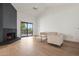 Bright living room with fireplace and sliding glass door to the backyard at 9125 E Purdue Ave # 214, Scottsdale, AZ 85258