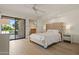 This main bedroom features a balcony and an en-suite bathroom at 9125 E Purdue Ave # 214, Scottsdale, AZ 85258