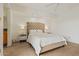 This main bedroom features a white bed and side tables with lamps at 9125 E Purdue Ave # 214, Scottsdale, AZ 85258