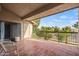 Spacious outdoor patio with tile flooring and views of the lush landscaping at 9125 E Purdue Ave # 214, Scottsdale, AZ 85258