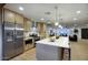 Stylish kitchen with stainless steel appliances, quartz countertops, and contemporary cabinets at 918 W Carmen St, Tempe, AZ 85283