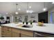 Beautiful kitchen island with a sink and modern fixtures, perfect for entertaining guests at 918 W Carmen St, Tempe, AZ 85283