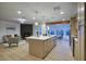 Bright and airy kitchen featuring a large island, modern appliances, and open concept living area at 918 W Carmen St, Tempe, AZ 85283