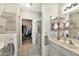 Elegant bathroom with dual sinks, walk-in shower, and access to a walk-in closet at 9455 E Raintree Dr # 2020, Scottsdale, AZ 85260