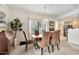 Dining room with a large plant, a light fixture, and a window at 9455 E Raintree Dr # 2020, Scottsdale, AZ 85260