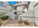 View of the condo building featuring well-maintained landscaping and neutral color palette at 9455 E Raintree Dr # 2020, Scottsdale, AZ 85260