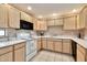 Well-lit kitchen with white countertops, white appliances, and ample cabinet space at 9455 E Raintree Dr # 2020, Scottsdale, AZ 85260