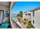 Community pool featuring desert landscaping and a variety of trees as viewed from an outdoor balcony at 9455 E Raintree Dr # 2020, Scottsdale, AZ 85260