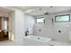 Luxurious bathroom features a soaking tub, shower, and modern black finishes at 10242 N 58Th St, Paradise Valley, AZ 85253