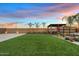 Spacious backyard featuring a pergola-covered hot tub and a hammock, perfect for relaxation at 10713 E Tesla Ave, Mesa, AZ 85212