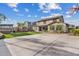 Spacious backyard features turf, covered hot tub, outdoor seating, and an open basketball court at 10713 E Tesla Ave, Mesa, AZ 85212