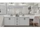 Chic bathroom with double sinks, sleek vanity, and modern fixtures, offering both style and function at 10713 E Tesla Ave, Mesa, AZ 85212