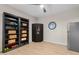 Versatile bonus room offering ample storage with built-in shelving and modern finishes at 10713 E Tesla Ave, Mesa, AZ 85212