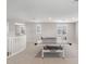 Bright and spacious game room features a ping pong table, and neutral color scheme for versatile entertainment at 10713 E Tesla Ave, Mesa, AZ 85212