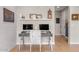 Cozy home office with stylish decor, dual monitors, and a decorative patterned accent wall at 10713 E Tesla Ave, Mesa, AZ 85212