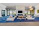 Comfortable lobby area with stylish seating, stone fireplace, and ample natural light at 10713 E Tesla Ave, Mesa, AZ 85212
