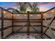 Outdoor shower featuring decorative side panels, overhead lighting, and a brick tile base at 10713 E Tesla Ave, Mesa, AZ 85212