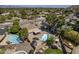 Aerial view showcasing a large backyard with a pool, trampoline, and mature trees at 10844 N 37Th St, Phoenix, AZ 85028