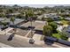 Overhead shot of a lovely home featuring mature palms, a private pool, and a spacious driveway at 10844 N 37Th St, Phoenix, AZ 85028