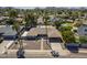 Overhead view of a well-maintained home boasting a sparkling pool, lush greenery, and a private driveway at 10844 N 37Th St, Phoenix, AZ 85028