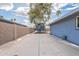 Spacious backyard featuring a basketball hoop, trampoline, and plenty of concrete for play at 10844 N 37Th St, Phoenix, AZ 85028