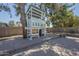 A backyard featuring a quaint treehouse with a nearby patio and rock garden at 10844 N 37Th St, Phoenix, AZ 85028