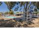 Expansive backyard with play structure, mature trees, and a pristine pool for outdoor relaxation and enjoyment at 10844 N 37Th St, Phoenix, AZ 85028