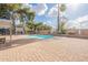 Backyard pool with brick patio, basketball court, and dining area perfect for outdoor entertaining at 10844 N 37Th St, Phoenix, AZ 85028