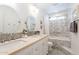 Bathroom featuring double sinks and a tub with decorative tile and a shower curtain at 10844 N 37Th St, Phoenix, AZ 85028