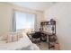 Bedroom with large window, desk and chair at 10844 N 37Th St, Phoenix, AZ 85028