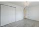Bedroom with large sliding door closets and stylish chandelier at 10844 N 37Th St, Phoenix, AZ 85028