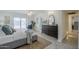 Bright bedroom with sliding glass door leading to pool, dresser and stylish furnishings at 10844 N 37Th St, Phoenix, AZ 85028