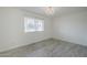 Charming bedroom with decorative chandelier and wood-look flooring at 10844 N 37Th St, Phoenix, AZ 85028