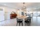 Open floor plan shows the dining room, piano, and kitchen at 10844 N 37Th St, Phoenix, AZ 85028