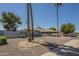 Charming single-story home showcasing mature palm trees and low-maintenance desert landscaping at 10844 N 37Th St, Phoenix, AZ 85028